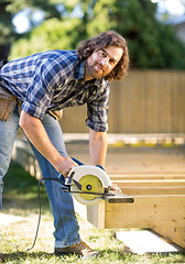 Image showing Carpenter Using Circular Saw