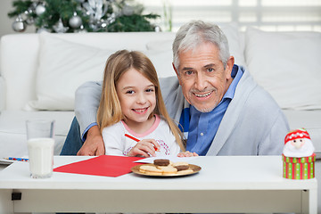 Image showing Happy Grandfather And Girl With Cardpaper