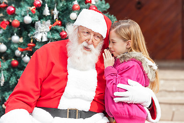 Image showing Girl Telling Wish In Santa Claus's Ear