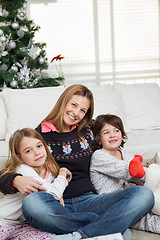 Image showing Mother And Children At Home During Christmas