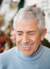 Image showing Senior Man In Christmas Store