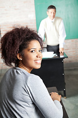 Image showing Student With Professor Standing In Background At Classroom