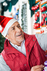 Image showing Senior Male Owner Working At Christmas Store