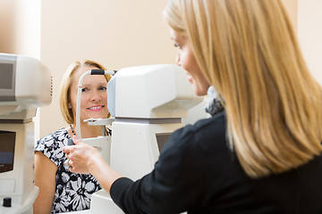 Image showing Optometrist Using Tonometer to Measure Patients Eye Pressure