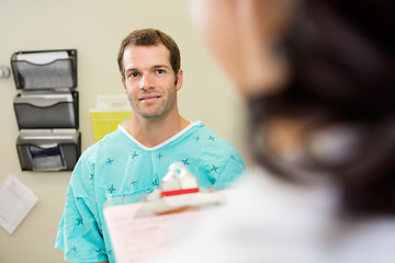 Image showing Smiling Patient Looking At Doctor