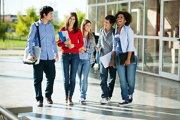 Image showing Cheerful Students Walking On Campus