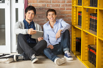 Image showing Students With Digital Tablet Sitting In University Library
