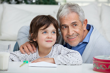 Image showing Boy And Grandfather With Envelope Smiling