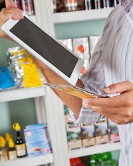 Image showing Man With Digital Tablet And Product In Supermarket