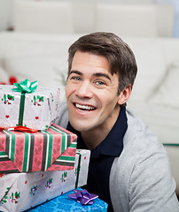 Image showing Smiling Mid Adult Man With Christmas Gifts