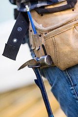 Image showing Hammer Hanging In Tool Belt Of Carpenter