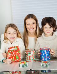 Image showing Happy Woman And Children With Christmas Gifts