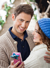 Image showing Happy Man Embracing Woman In Christmas Store