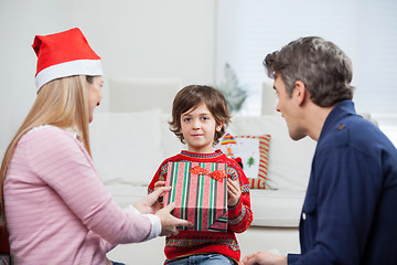 Image showing Boy Taking Christmas Present From Mother