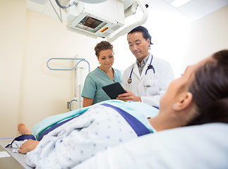 Image showing Medical Team Using Digital Tablet In Examination Room