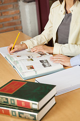 Image showing Students Studying At Table In Library