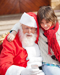 Image showing Boy And Santa Claus Using Smartphone