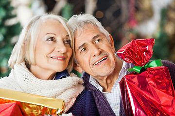 Image showing Couple With Christmas Presents In Store