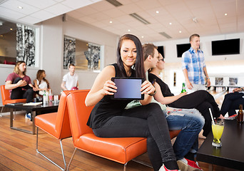 Image showing Woman Showing Digital Table in Bowling Club