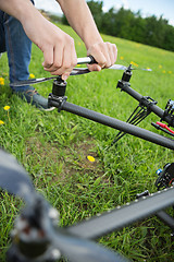 Image showing Engineer Fixing Propeller Of UAV Helicopter