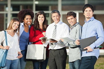 Image showing Confident Professor And Students Standing On University Campus