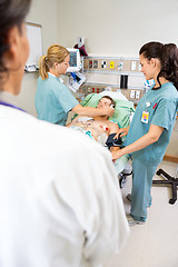Image showing Nurses And Doctor Treating Critical Patient