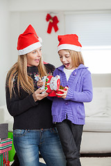 Image showing Surprised Mother And Daughter With Christmas Gift