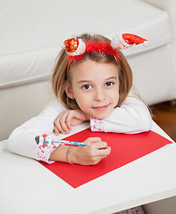 Image showing Girl Making Christmas Greeting Card