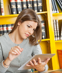 Image showing Student With Digital Tablet Studying In University Library