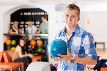 Image showing Man Holding Bowling Ball in Club