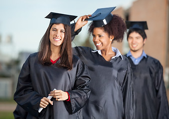 Image showing Confident Student Holding Certificate On College Campus