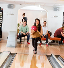 Image showing Woman Holding Bowling Ball in Club