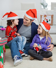 Image showing Loving Father With Siblings During Christmas