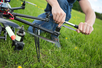 Image showing Technician Tightening Propeller Of UAV Drone