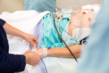 Image showing Nurse Attaching IV Solution On Patient's Hand