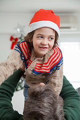 Image showing Playful Father Carrying Son