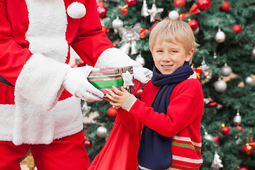 Image showing Boy Taking Present From Santa Claus