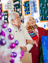 Image showing Senior Couple Shopping At Christmas Store