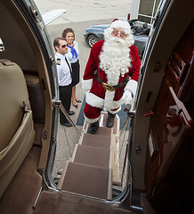 Image showing Portrait Of Santa Boarding Private Jet