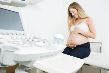 Image showing Pregnant Woman Sitting By Ultrasound Machine