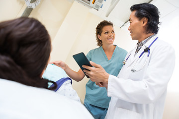 Image showing Medical Team With Digital Tablet In Examination Room