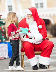 Image showing Santa Claus Taking Letter From Girl