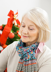 Image showing Senior Woman In Front Of Christmas Tree