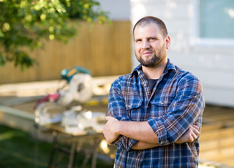 Image showing Manual Worker With Arms Crossed Standing At Construction Site