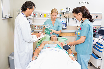 Image showing Doctor And Nurses Treating Critical Patient