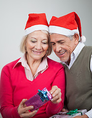 Image showing Happy Senior Couple Looking At Christmas Gifts