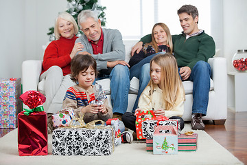 Image showing Three Generation Family With Christmas Presents