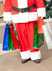 Image showing Santa Claus Carrying Shopping Bags