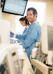 Image showing Researcher With Colleague Working In Laboratory