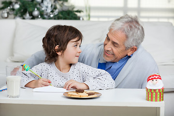 Image showing Boy And Grandfather Writing Letter To Santa Claus